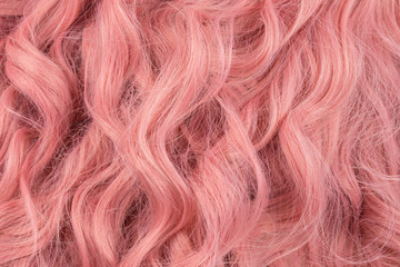 Naklejka premium Pink wavy hair pattern. Top view.