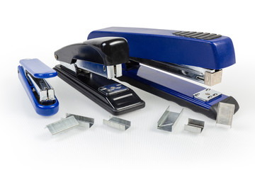 Paper staplers different sizes and metal staples to them