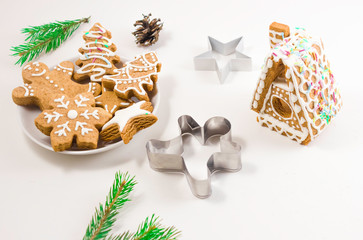 Gingerbread gingerbread on a plate on a light background, gingerbread house