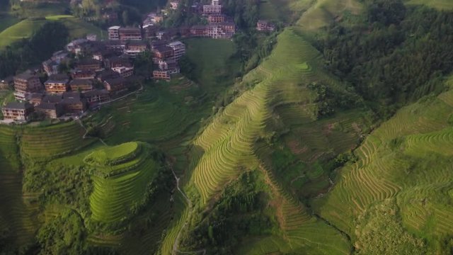 View on village in Chinese rice field valley