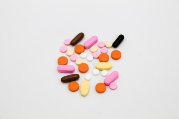 Top view of colorful pills isolated on white background