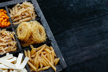 italian pasta in a box. Raw pasta. Farfale, cappelli angelo, spaghetti, cavatelli, noodles