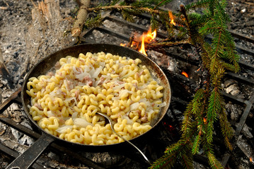 Cooking on the fire.