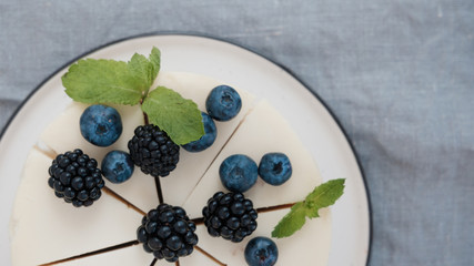 cheesecake with blueberries and blackberries. top view
