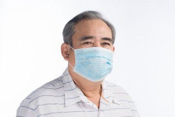 Asian senior man wearing face mask isolated on white background, selective focus.