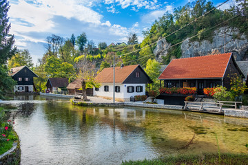 Fototapeta na wymiar Beautiful village of Rastoke near Slunj in Croatia, river Slunjcica, old water mills and cottages