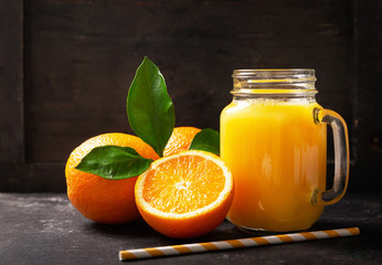 glass jar of fresh orange juice with fresh fruits