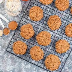 Spicy pumpkin and oatmeal cookies on cooling rack, top view,  square format