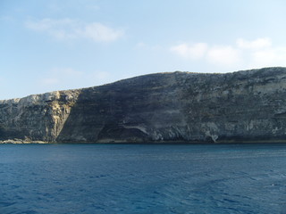 Fototapeta na wymiar Malta steep coastal area seen from the sea