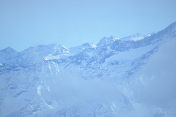 vista at mountain top French alps ice grey snow sky view