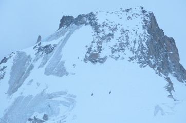 Fototapeta na wymiar vista at mountain top French alps ice grey snow sky view