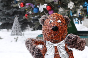 A bear from shiny garlands in outdoor park, design of a recreation area for children, horizontal orientation