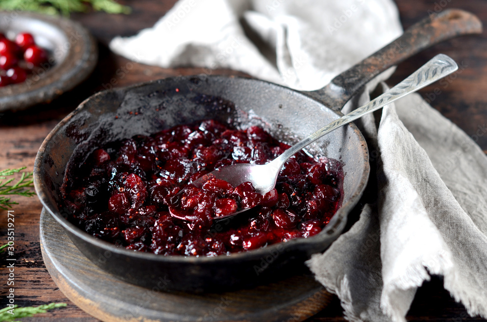 Wall mural Cranberry sauce in a pan, christmas, rustic