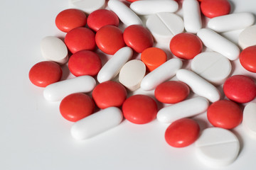 colorful pills and tablets on white