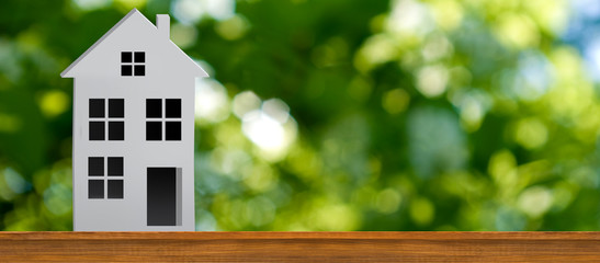 image of stylized house in the garden on green background