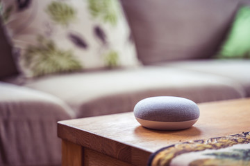 voice controlled smart speaker in a interior home environment. Smart AI speaker concept