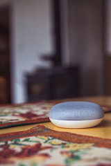 voice controlled smart speaker in a interior home environment. Smart AI speaker concept