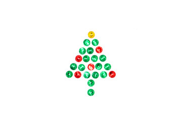 Christmas tree symbol made from red, green and gold glitter sparkles in the center on a white background. Flat lay, top view christmas, new year, winter creative concept.