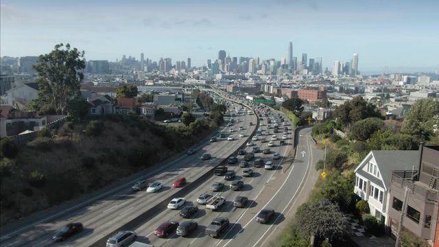 Aerial over The San Francisco City Skyline & Highway 101 freeway traffic. California, Usa