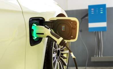 Power supply connect to electric car for add charge to the battery. Charging re technology industry...
