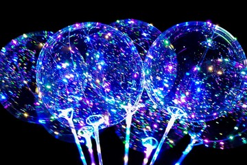 Illuminated balloons at night. © Marina