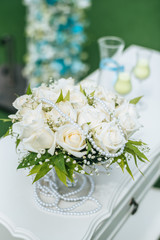 Wedding ceremony. Arch; decorated with flowers.