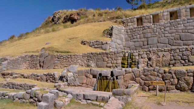 Water sources & fountains at different levels. Inca construction with water canalization between the stone walls. Archaeological Site of Tambomachay in the Cusco region, Peru