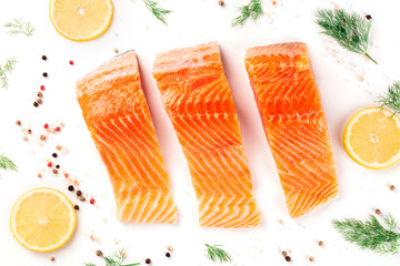 Slices of salmon with lemon and dill, shot from above with salt and pepper, cooking fish, on a...
