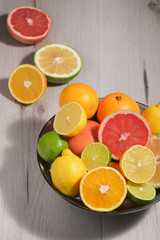 Fototapeta na wymiar Assortment Of Citrus Fruit on Wooden Table