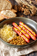 Grilled sausages with lentils. German cuisine. Beer.
