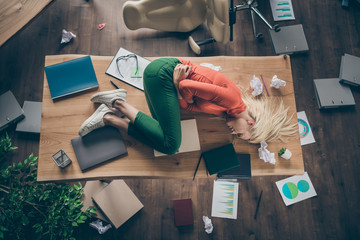 High angle above view photo of corporate messy atmosphere unorganized blond business lady lying...