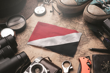 Principality of Sealand Flag Between Traveler's Accessories on Old Vintage Map. Tourist Destination...