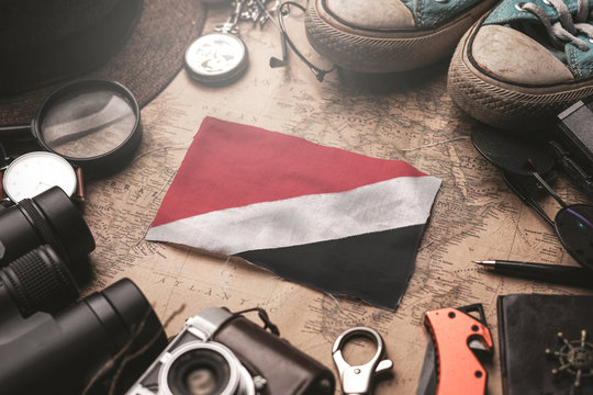 Principality of Sealand Flag Between Traveler's Accessories on Old Vintage Map. Tourist Destination Concept.