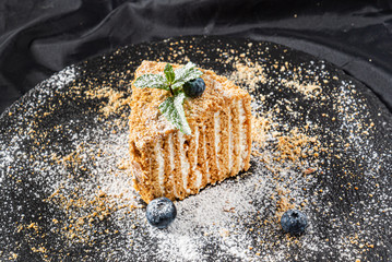 cake with cream on the black background