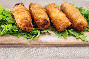pork spring rolls Rice cakes stuffed with a pork stuffing accompanied by sauce