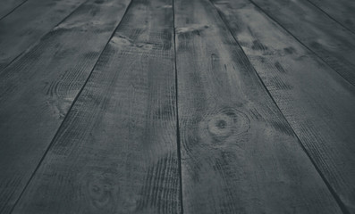 The empty wooden black table. The background from painted planks from wood