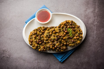 Chana Dal Bhabra / Babra served with tomato ketchup, popular food from Bihar / Bhojpur of India