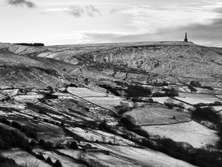 snow covered landscape with fields and moors near stoodley pike in west yorkshire.