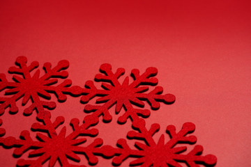 Christmas decoration of red snowflake on red background.  