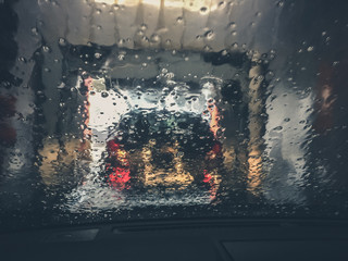 Automatic conveyor car wash. View from the auto. Smartphone photo
