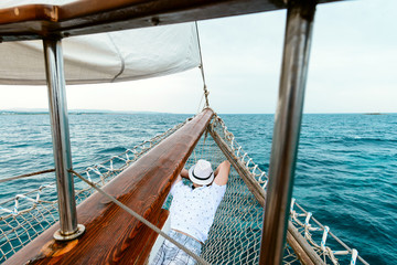 man resting or sleeping on the yacht, summer vacation
