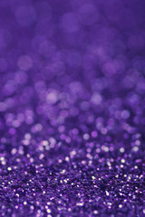 Purple glitter lights background. defocused