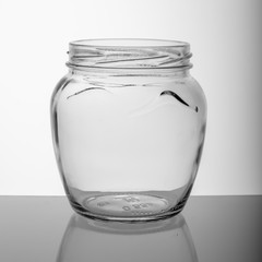 empty glass jar on a gray background