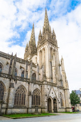 Quimper in Brittany, the Saint-Corentin cathedral in a beautiful medieval street 