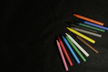 color pencils on wooden background