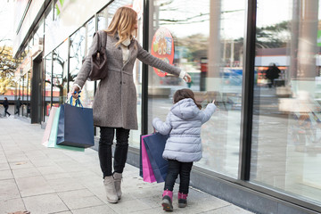 Mother with daughter going shopping