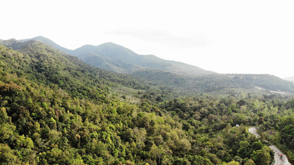 Fototapeta na wymiar Beautiful view from drone of the green mountain range in Ranong Southern part of Thailand