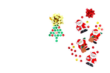 Christmas tree of red, green and gold spangles on a white background, gift bows and four Santa Claus. Creative christmas composition flatlay