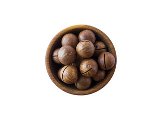 Studio shot of macadamia on white background. Heap of macadamia in nutshell isolated on white. Nuts  in a bowl with copy space for text. Macadamia close-up.