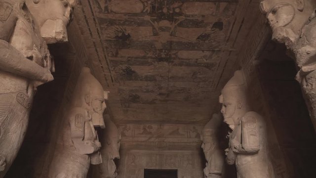 The entrance of Abu Simbel temple with Osiris statues.